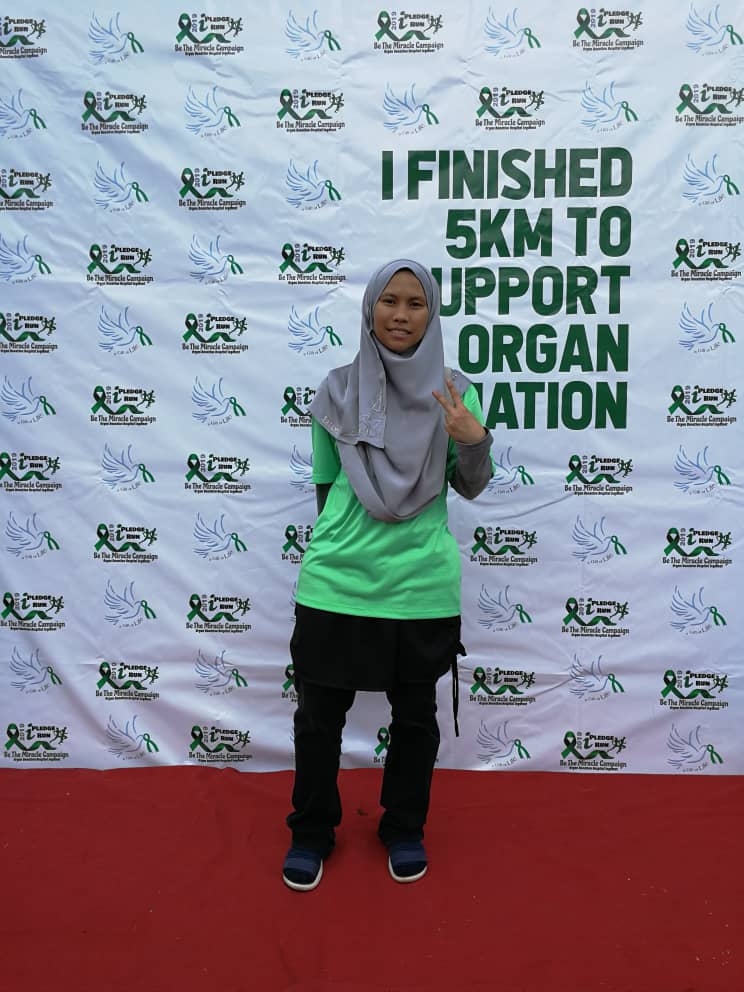 Salah seorang peserta  iPledge Fun Run, Siti Hairunnisaq Isa