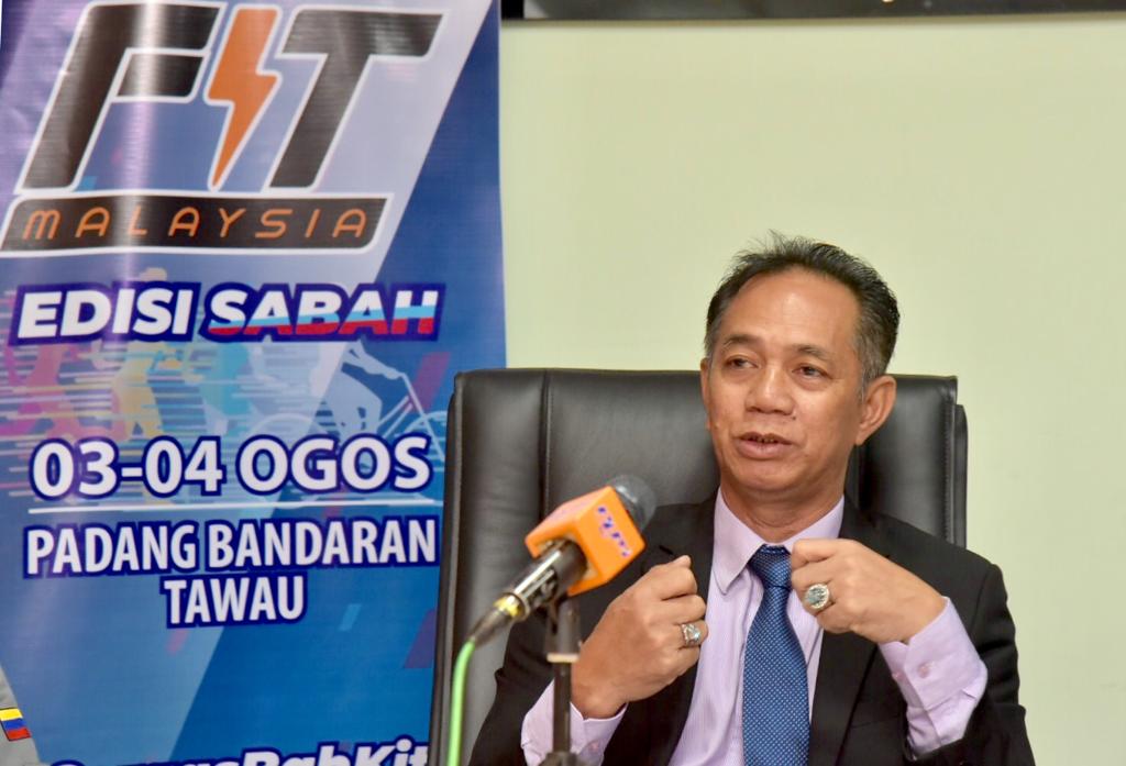 Arunarsin memberi penerangan berkenaan program FitMalaysia Peringkat Negeri Sabah