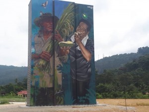 Mural yang bertajuk 'The Joy Of Harvest' adalah hasil karya dua pelukis dari Sarawak iaitu Leonard Siew dan Jagung