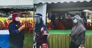 Rohana Yusof, 46 bersama dua orang anak antara penduduk yang telah menerima suntikan pertama hari ini.