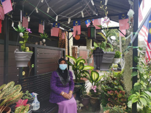 Rahimah Hassan, 57 berkata Sambutan Hari Malaysia tidak lengkap sekiranya tiada hiasan Jalur Gemilang di kediamannya.